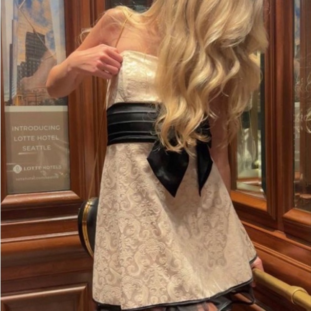 Elegant Cream and Black Dress with Bow